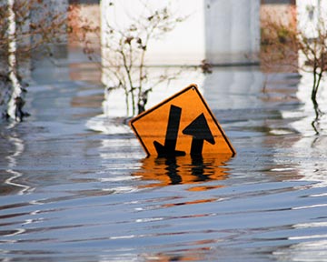 Hazardous road conditions like the flood here are reason for a truck driver to pull over and await safer driving conditions. If you have been injured by a trucker driving negligently during hazardous conditions, contact a Houston, Texas Truck Accident Lawyer or Houston Trucker Negligence Attorney today for a free initial consultation. 